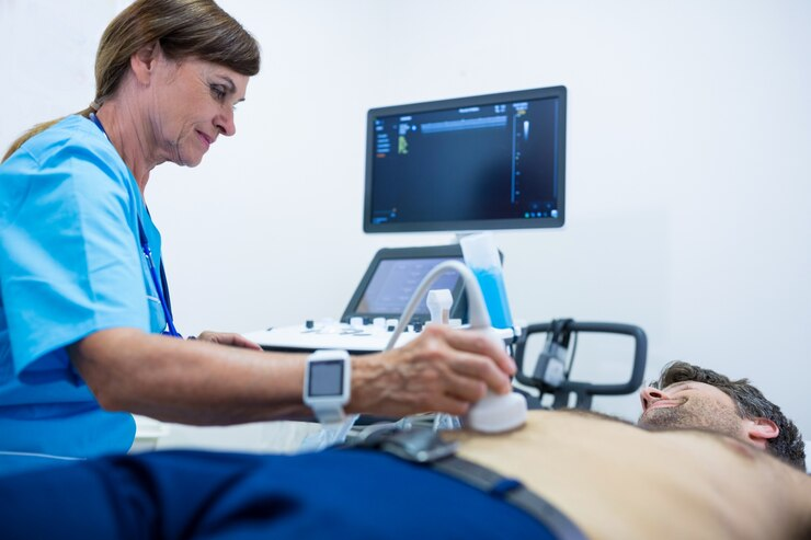 A medical professional performs an ultrasound on a patient in a clinical setting.